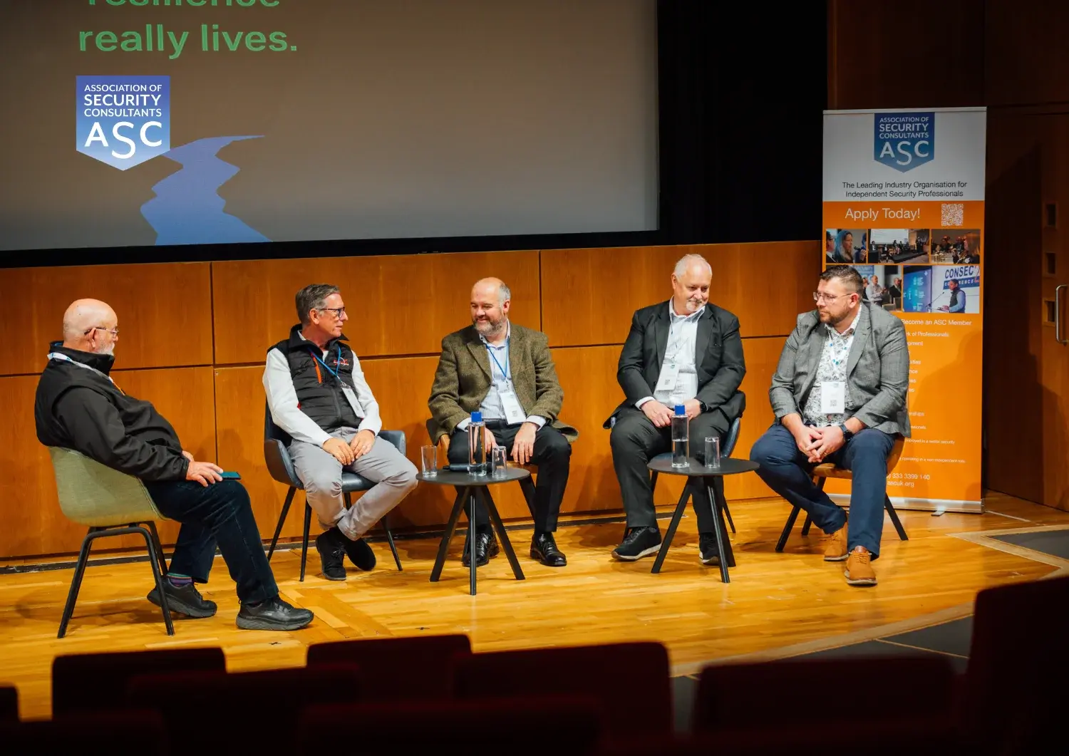 ASC panellists on stage during a seminar session