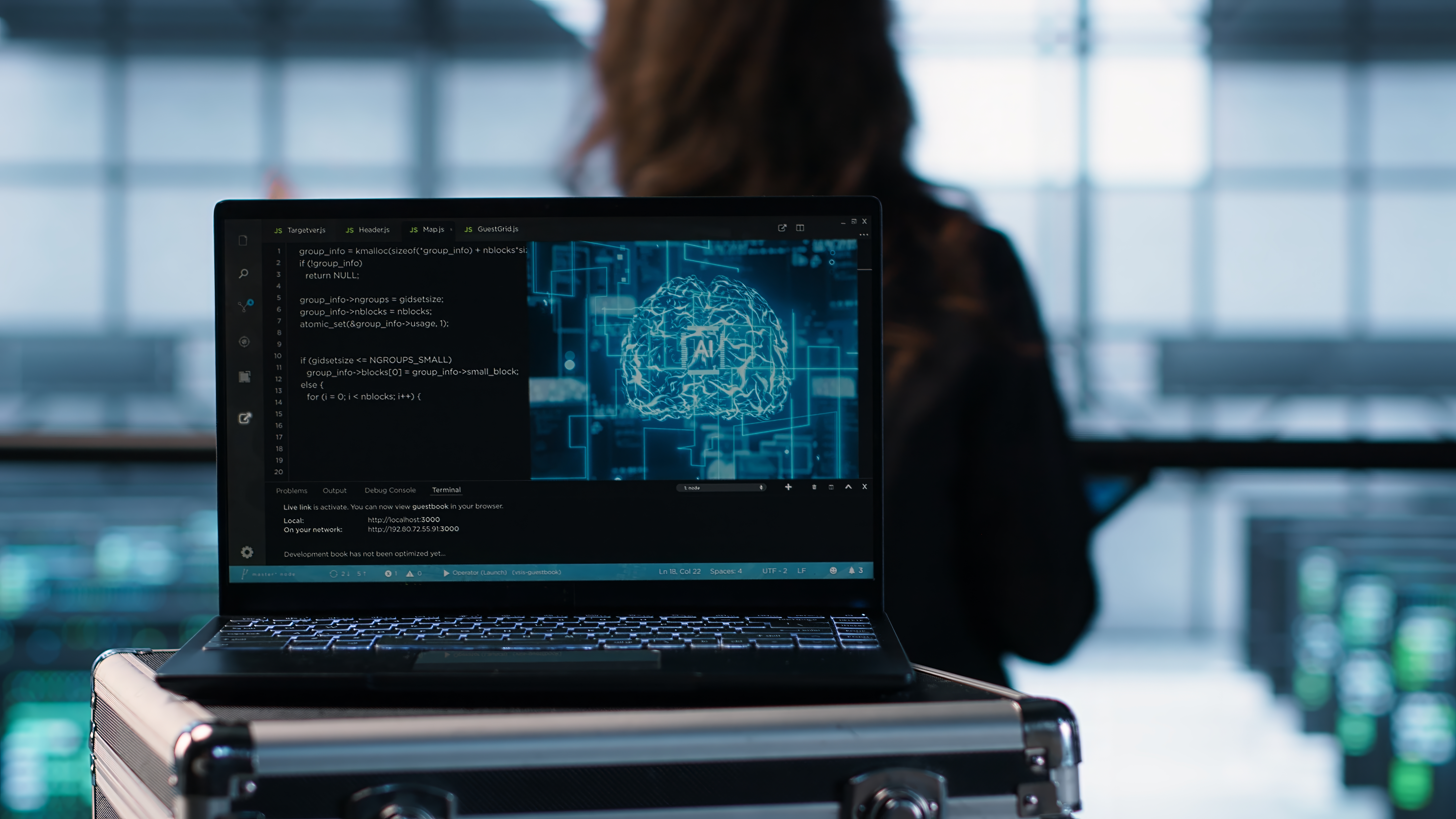 Ai coding on notebook screen next to technicians inspecting servers close up