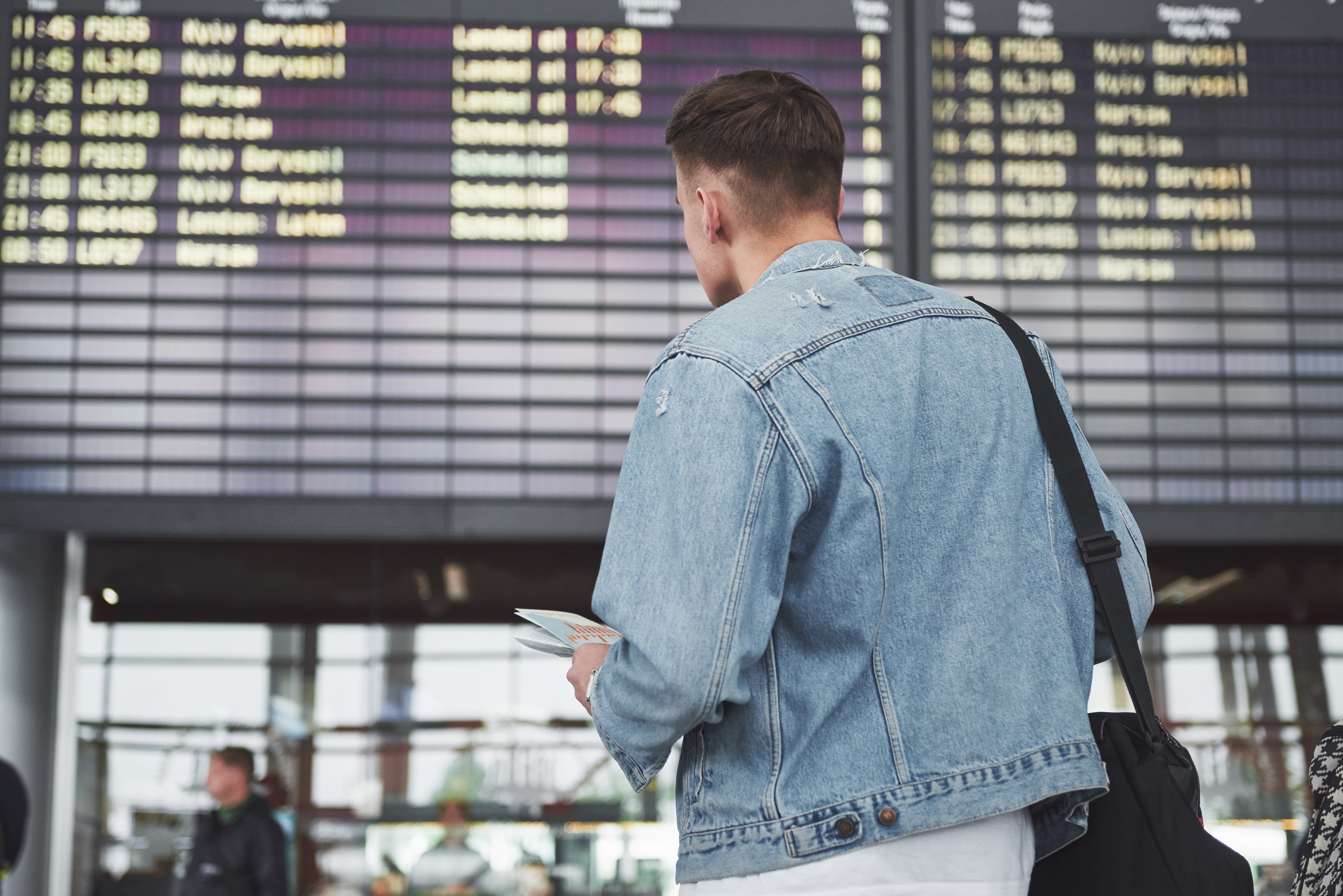 The man expects his flight at the airport